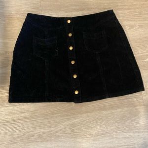 Black velvet skirt with button front. Size large.